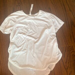 Great condition white lululemon athletic t shirt with open sides. Size 2